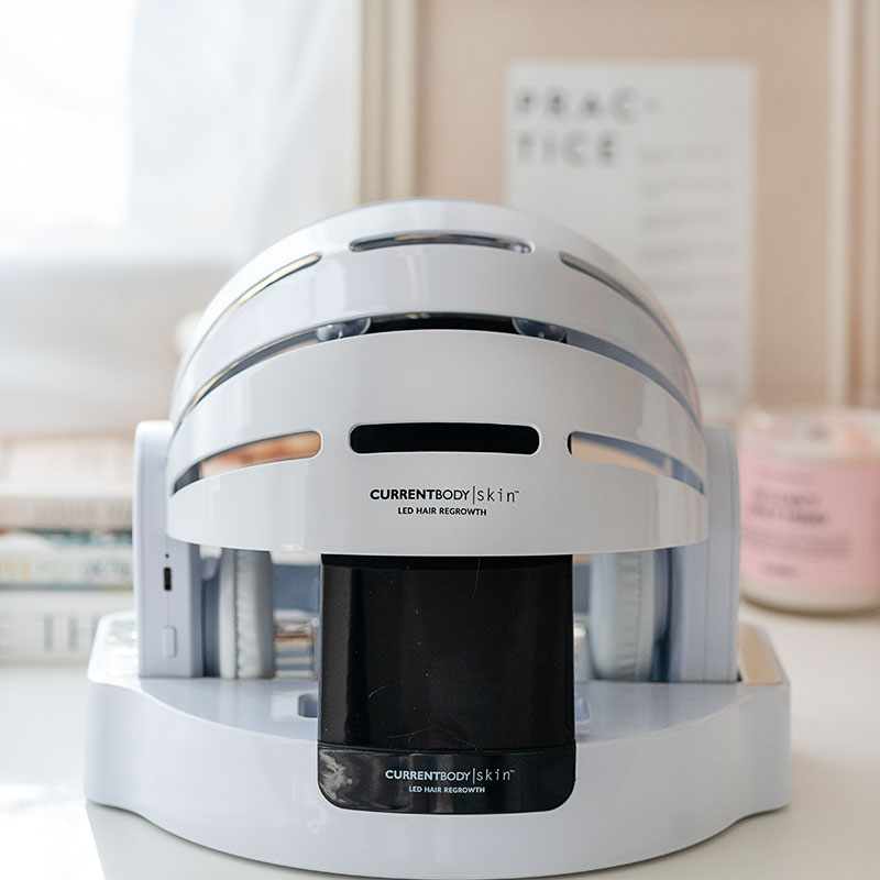 CurrentBody Skin LED Hair Regrowth Device on its stand